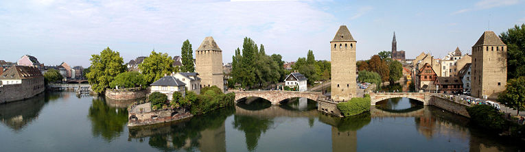 Strasbourg's medieval bridge Ponts Couverts in the foreground and the 
cathedral in the distance.
